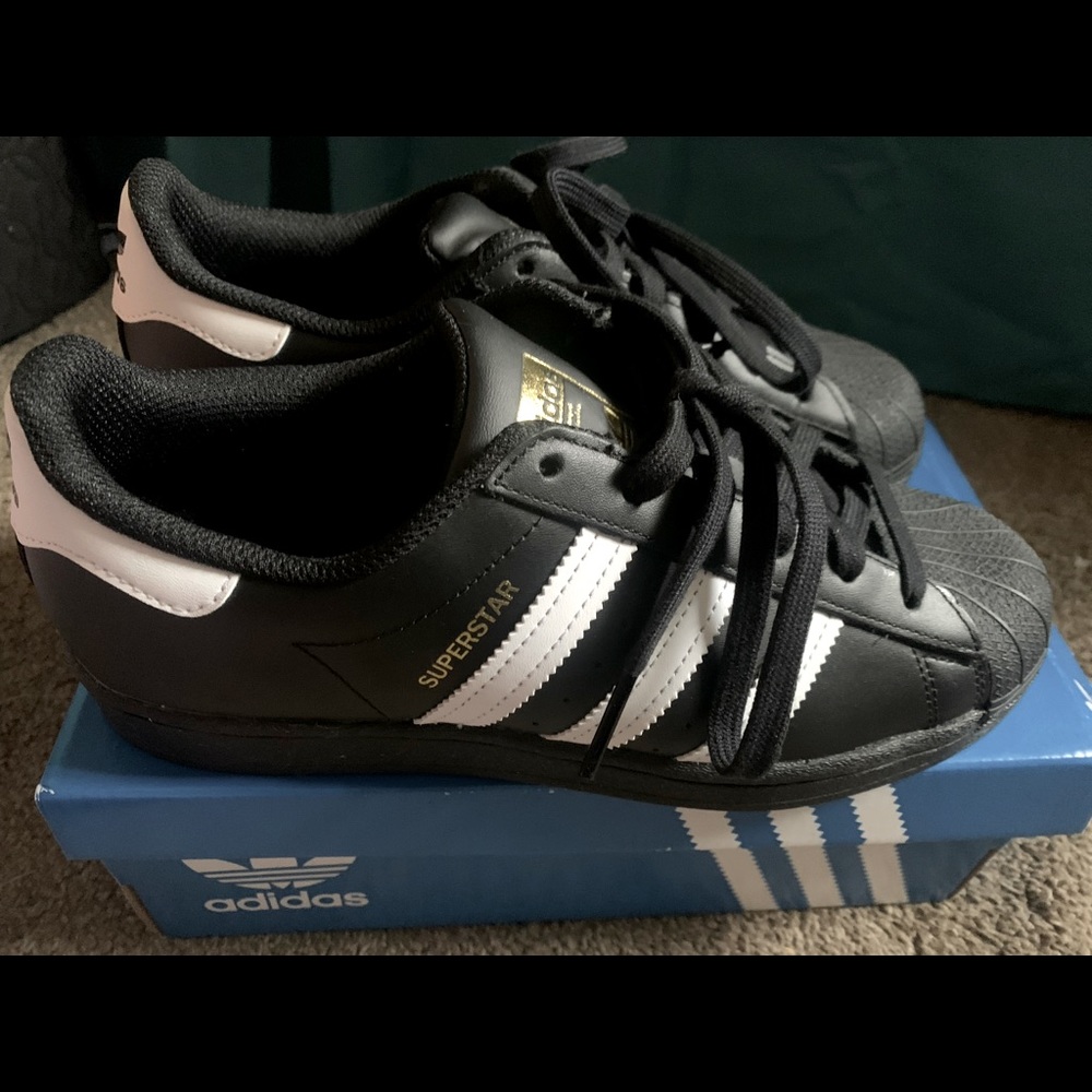 Black and white adidas superstars (shelltoe)